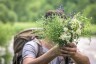man-hike-holds-bouquet-wildflowers_main